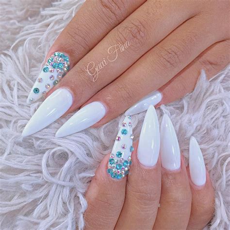 white stiletto nails with rhinestones